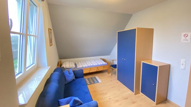 Schlafzimmer mit Sofa